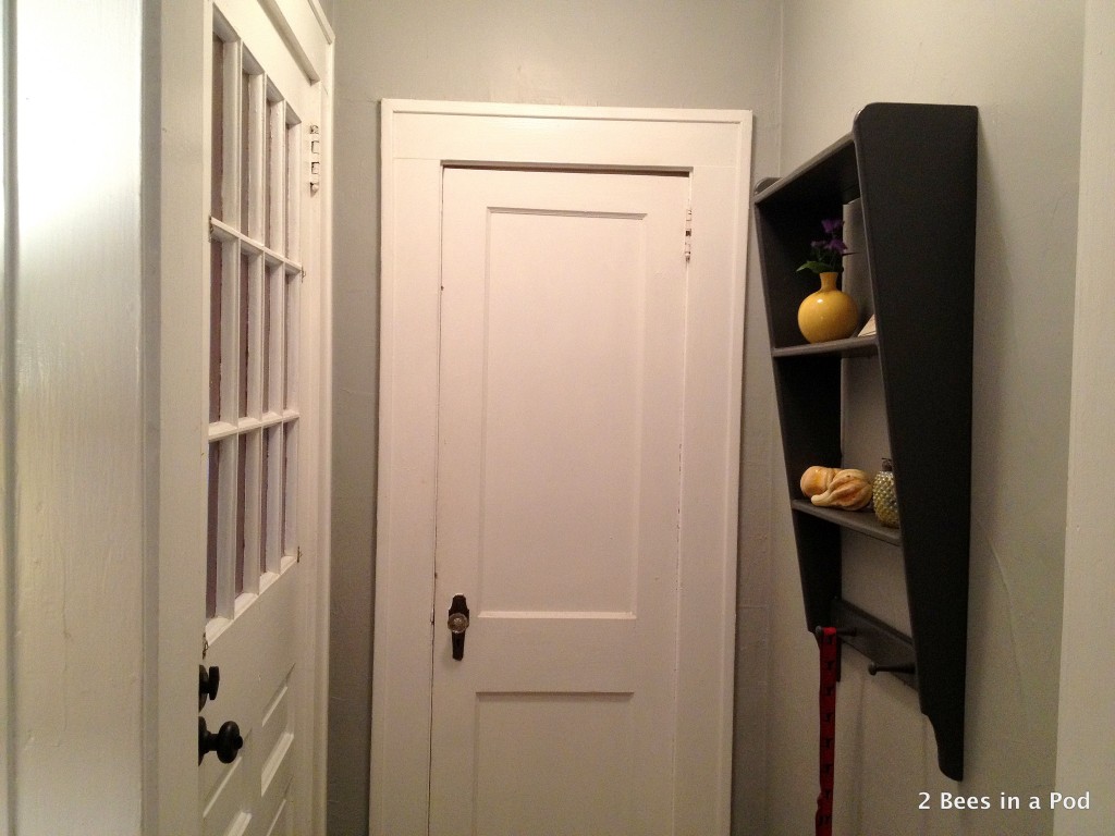 Entry Way with new shelf I painted dark grey and added yellow accent pieces.