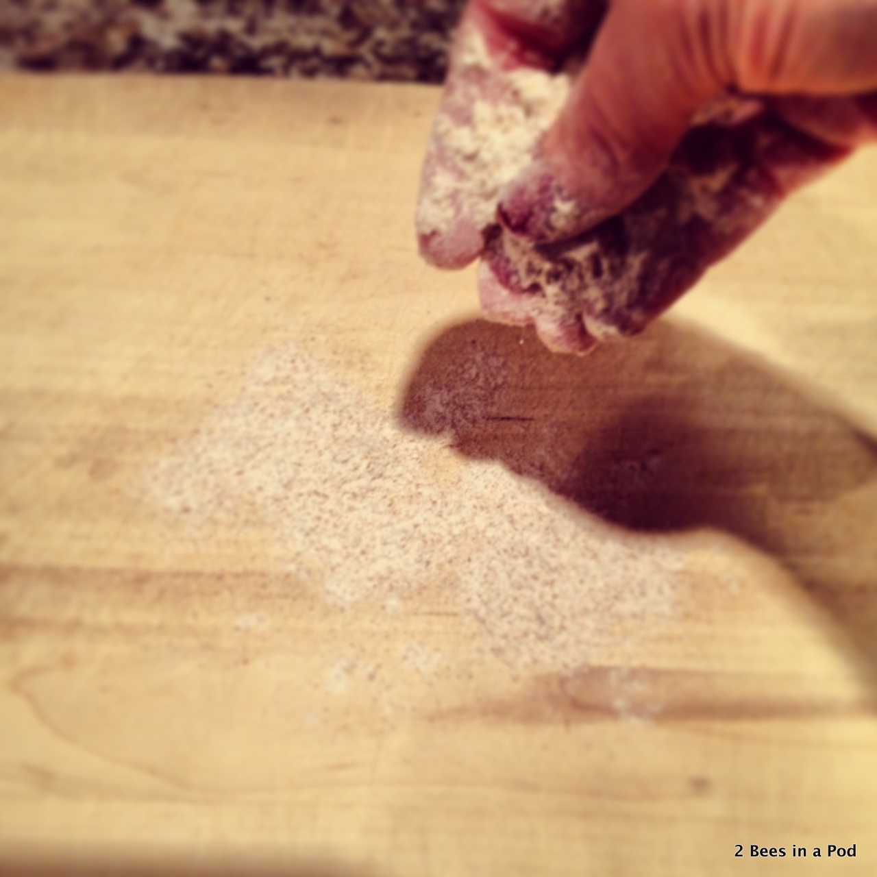 1-Putting flour on surface to roll dough for homemade dog treats