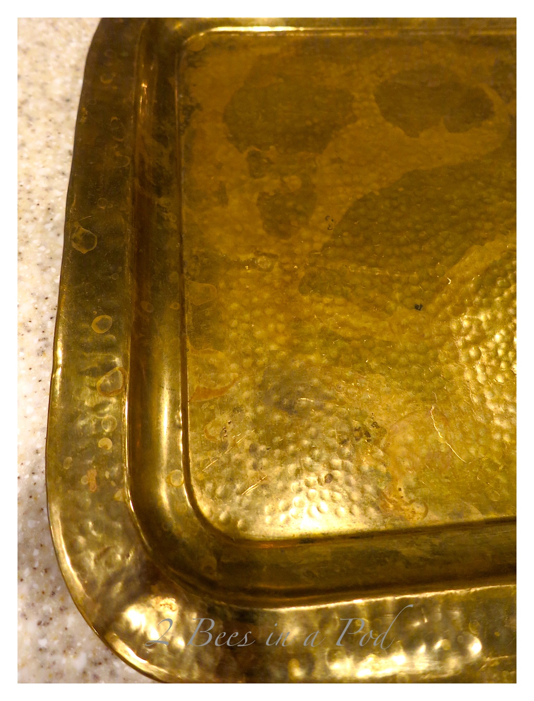 This pretty Hammered brass tray was a 10 cent thrift store find.  It was brought back to life with just a little brass cleaner.