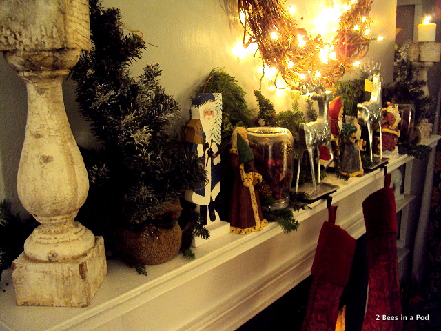 Stockings from Pottery Barn, hand painted Santa's, greenery, burlap, grape vine wreath, lit fireplace, Christmas Mantle
