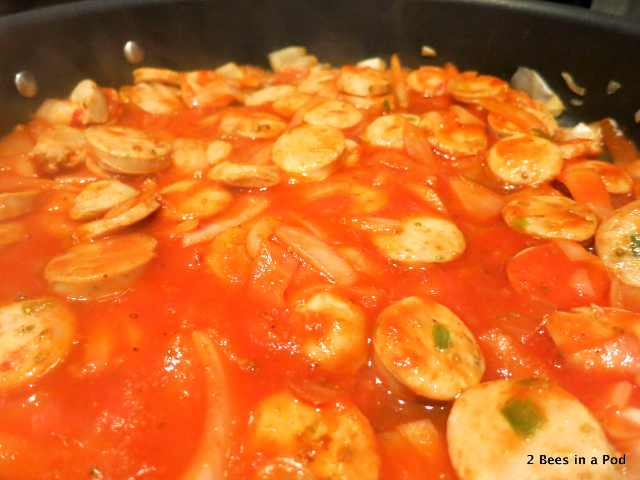 Onions & Sausage simmering in tomato sauce for Polenta & Sausage Weight Watchers Recipe
