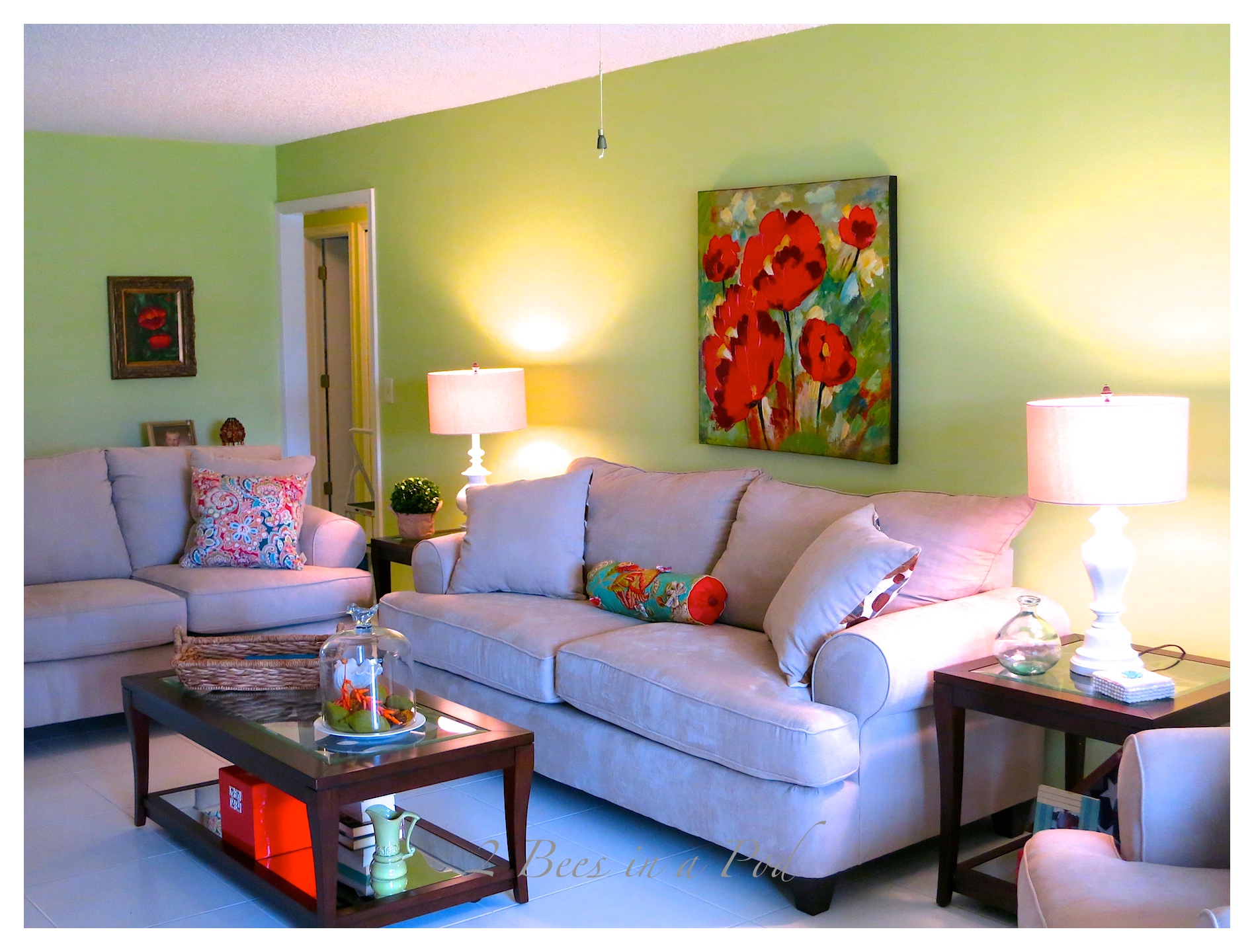 What a difference a bright paint color makes in this Palm Beach living room Makeover. Pops of green and coral and beach elements.