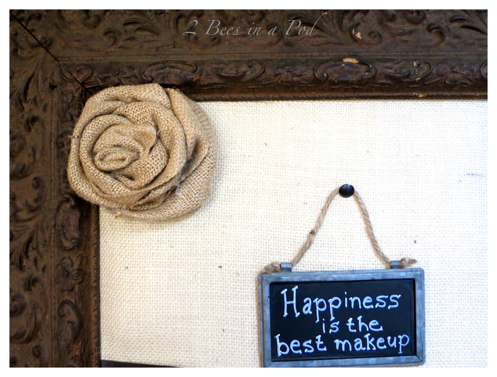 DIY burlap bulletin board. Made from a salvaged antique frame, burlap, foam board and batting. Cute decorated with vintage decor.