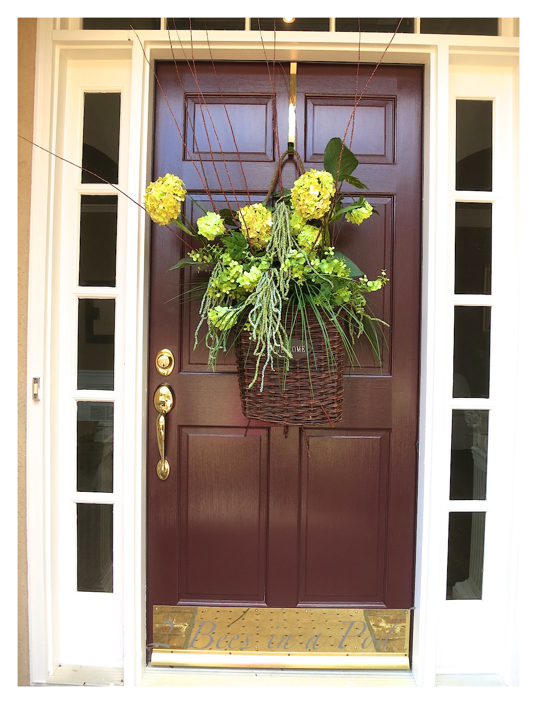 A welcome basket wreath for the front door to mark the beginning of Spring! Florals mixed with natural elements makes for a beautiful display on the front door.
