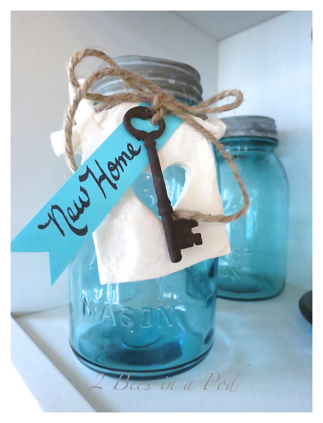 A cute and creative housewarming gift - vintage aqua Mason jar, antique skeleton key, DIY pottery clay tag. Fill the jar with treats of your choice. 