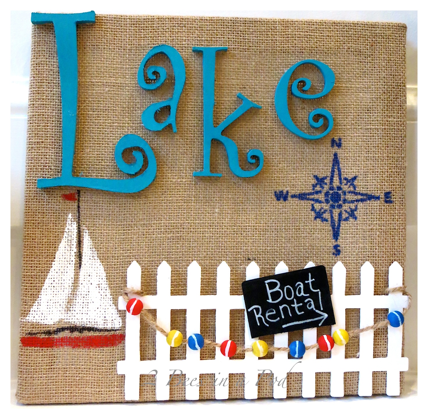 DIY Lake Wall Art - simple artwork using a wrapped burlap canvas, decorative wood pieces and paint. Ready to display your lake scene.