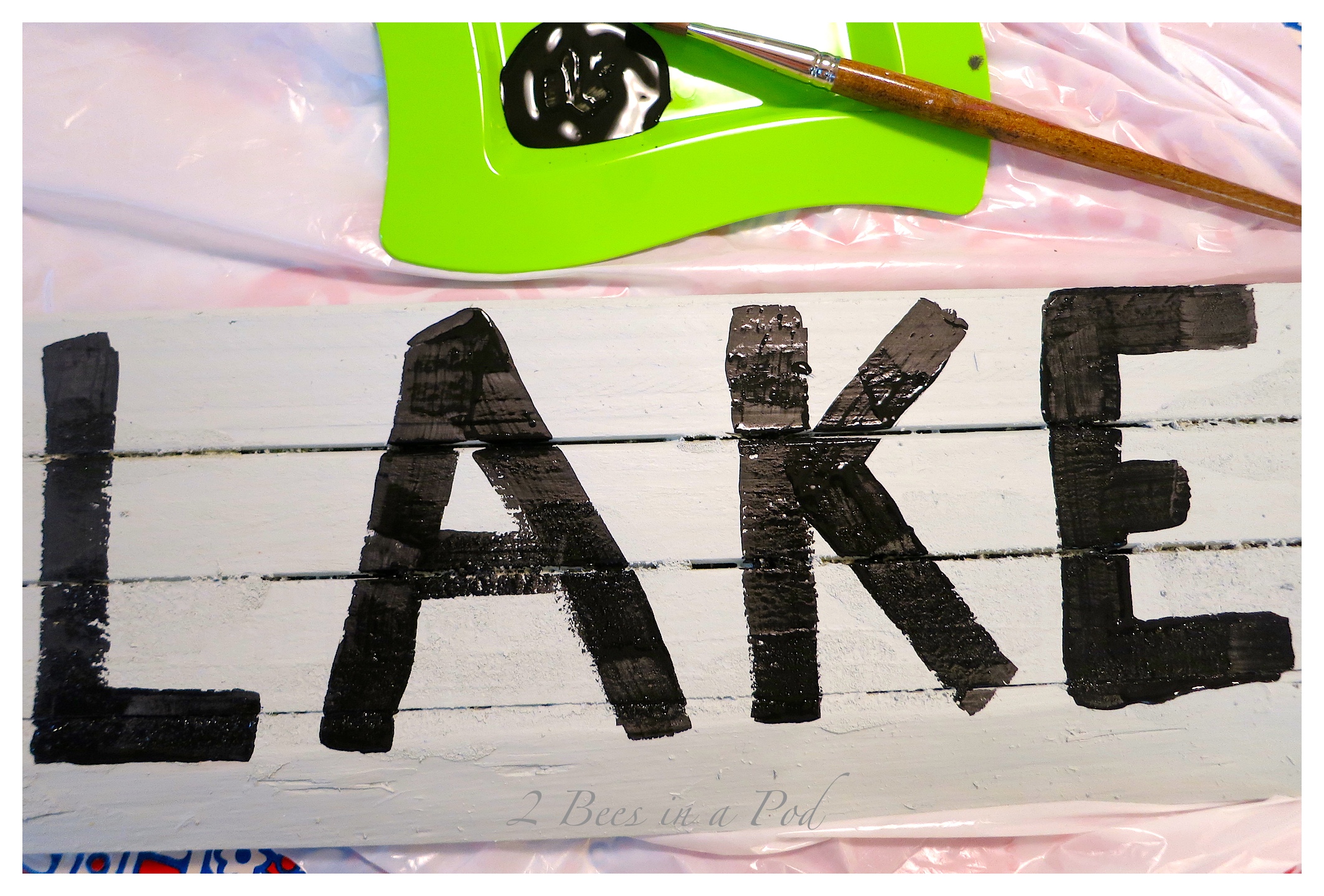 DIY Rustic Vintage "Lake" Sign - so easy to make using grade stake pickets from the hardware store. Paint and wax for an antiqued finished look.