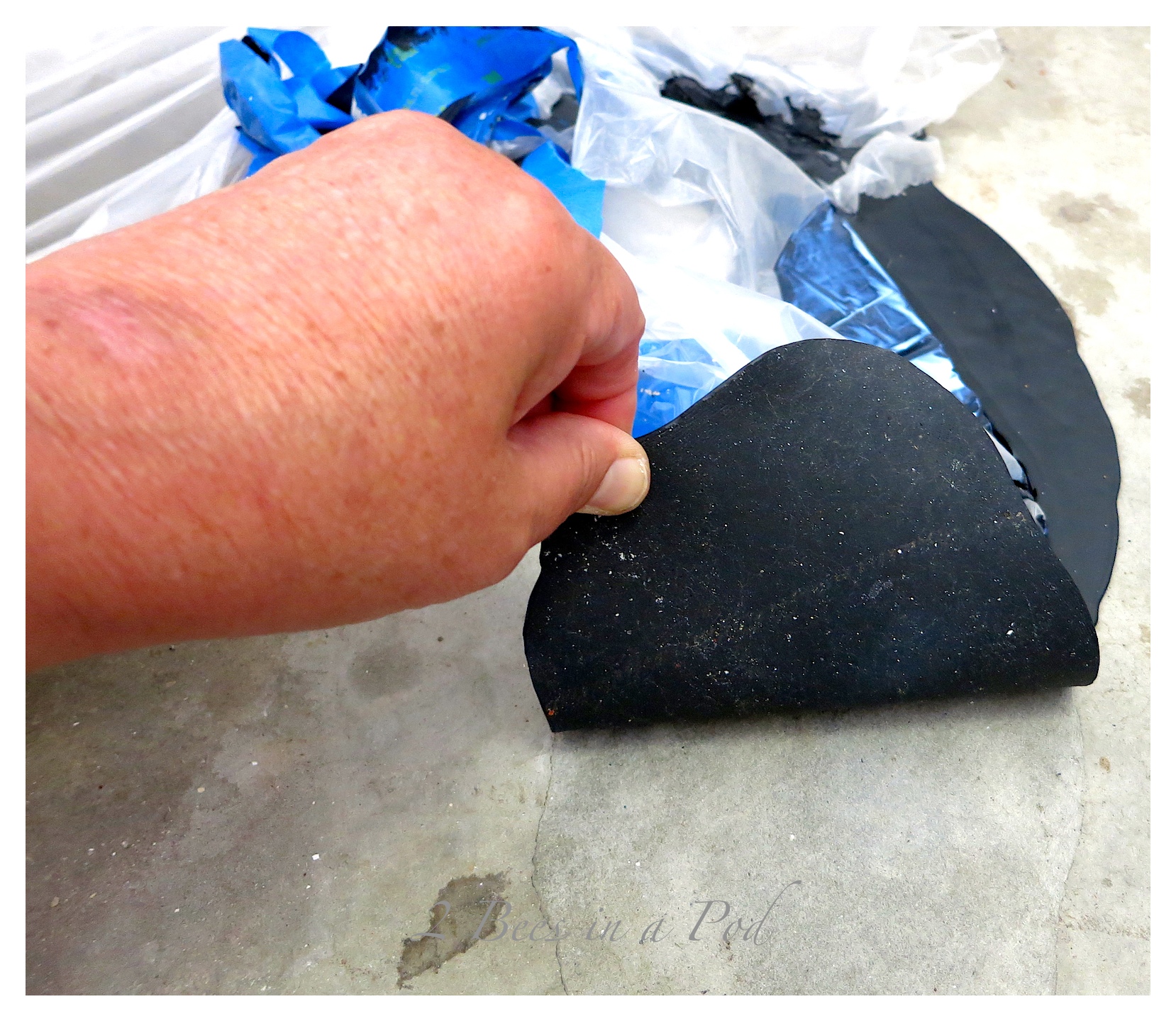 How to clean up spilled chalkboard paint off of concrete.