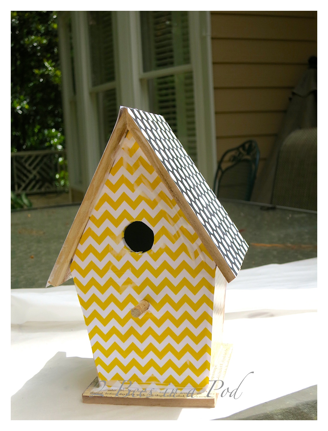 Create a decorative birdhouse. we usedd Mod Podge. scrapbook paper, antique book pages and a pre made birdhouse. For added decoration we made flowers from the antique book pages.