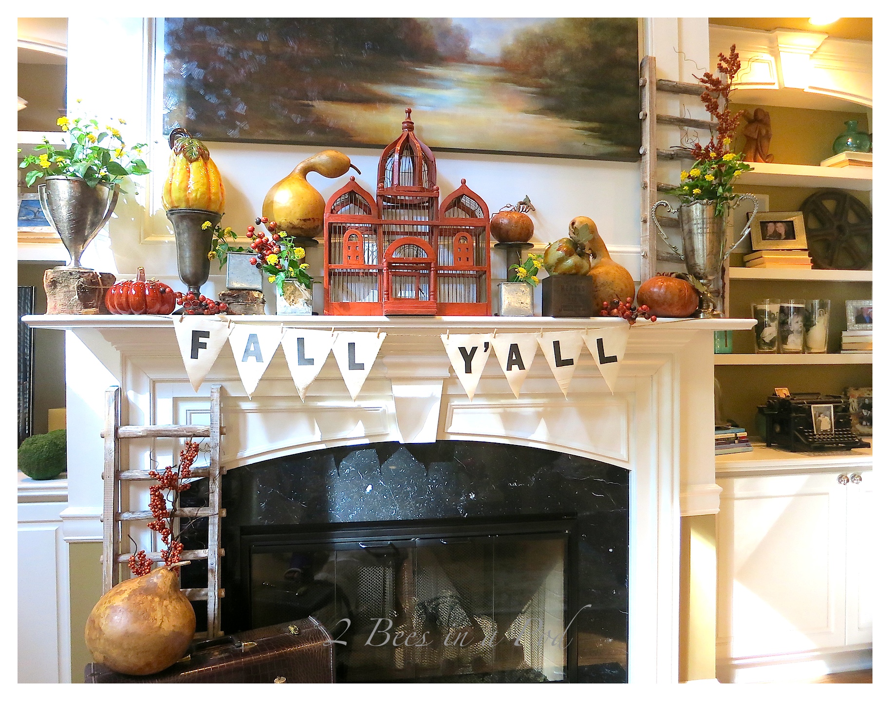 Fall Mantle Decor...Bloggers Fall Tour.  Mantle decorated with vintage and rustic items. Muted colors for Fall. Natural gourds, vintage trophies and loving cup, vintage suitcase, vintage wicker wine bottle, rustic ladders.