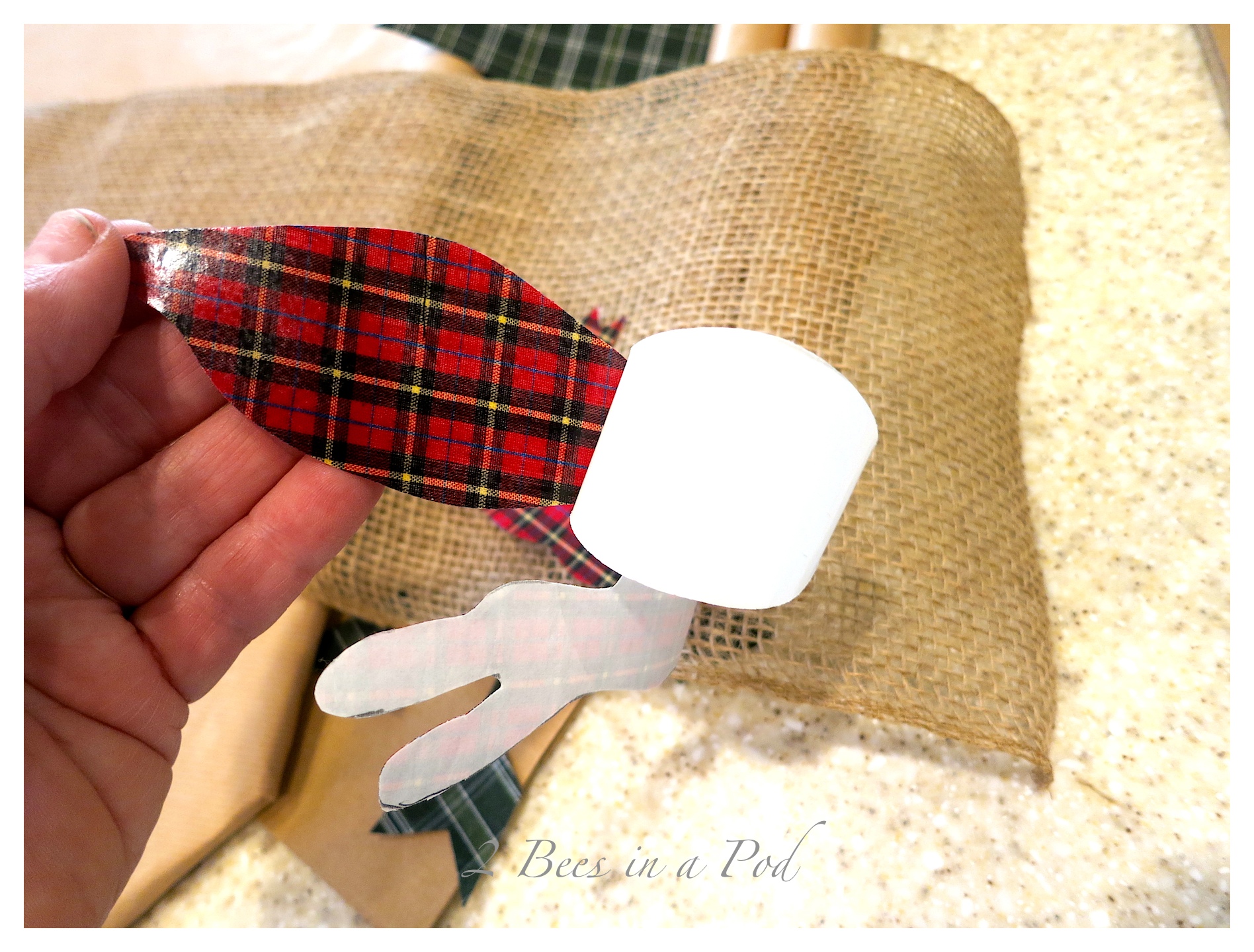 DIY Christmas Gift Wrap - Woodland Fox and Christmas Plaid. a hand painted wood slice fox as a gift tag. Bags Made from thrift store plaid shirts, Heat and Bond and cut out shapes ironed onto kraft bags. Also used a shirt as gift wrap and decorated the pocket :)