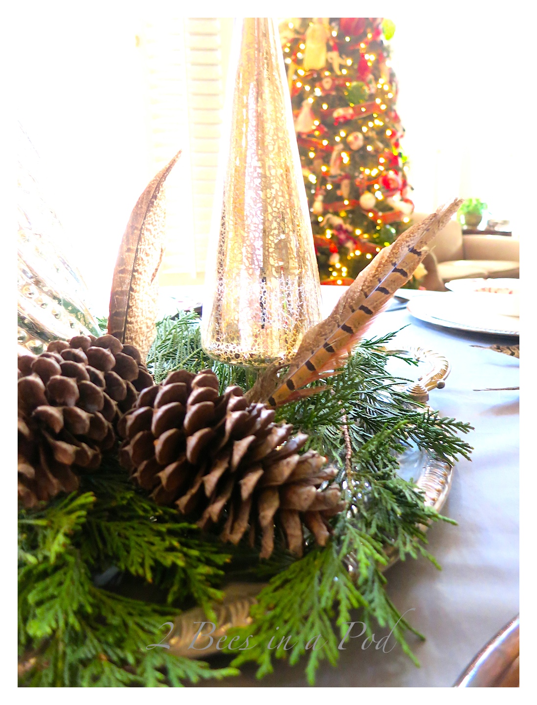 Casual Christmas Tablescape - using vintage silver, vintage red and white transfer ware, gray and red. Fresh cut greenery and mercury glass trees create a lovely centerpiece.