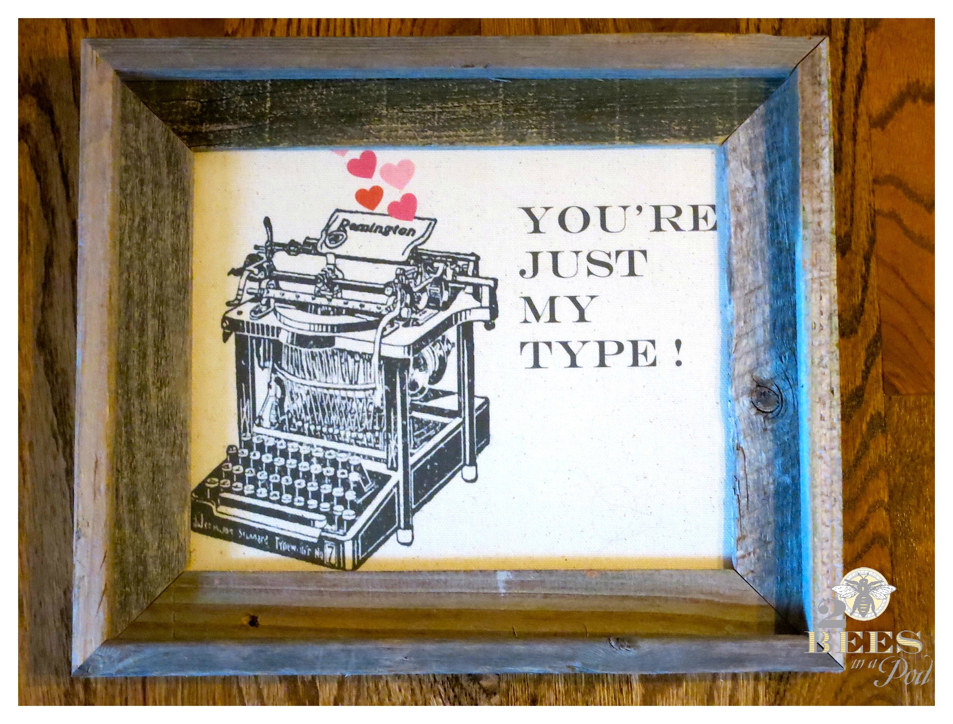 Valentine message printed on fabric and placed in a rustic frame. Graphics of a vintage typewriter "You're Just My Type"