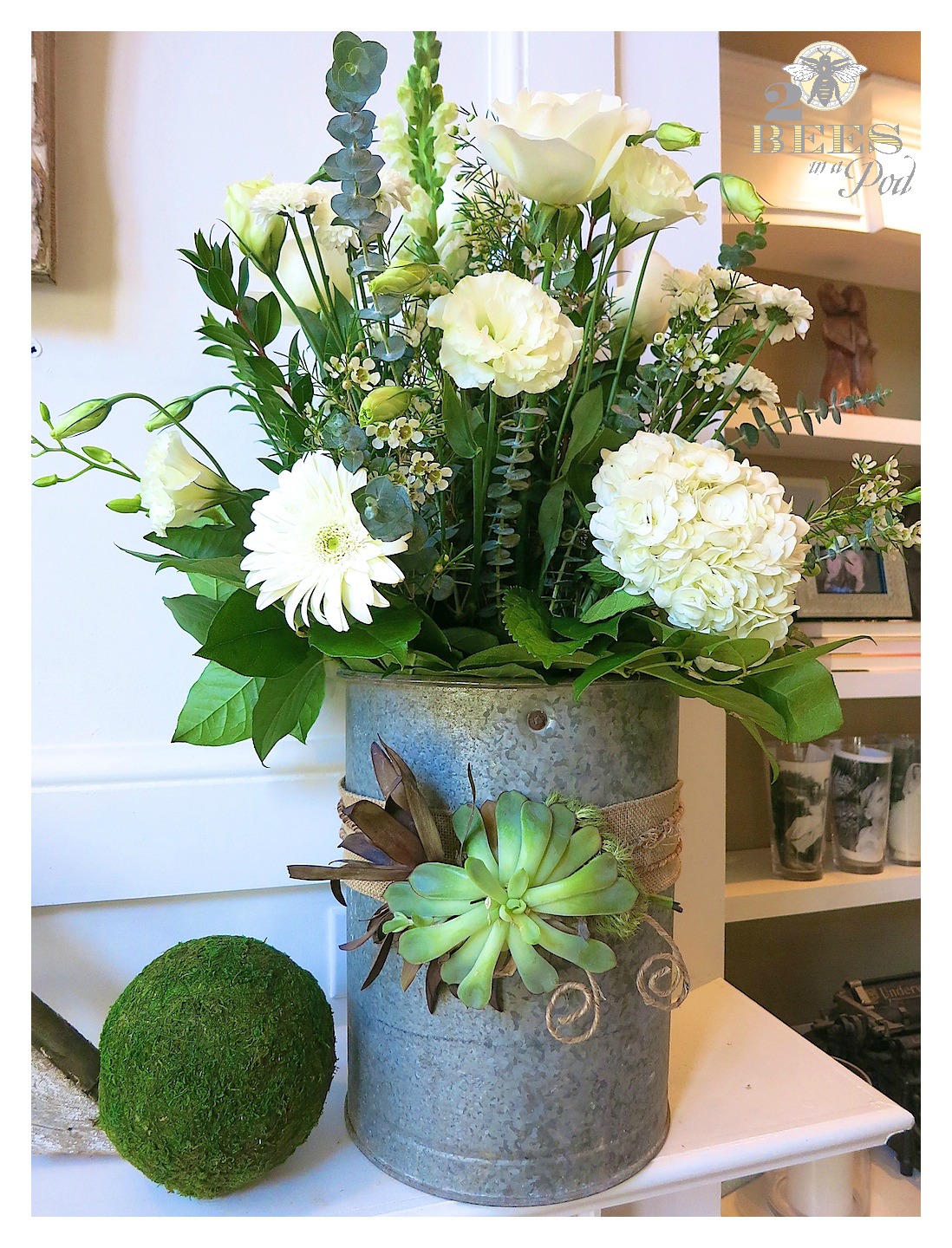 Spring Mantle Update - bright turquoise and vintage, weathered decor. Fresh white flowers, bunny, moss, bird nest