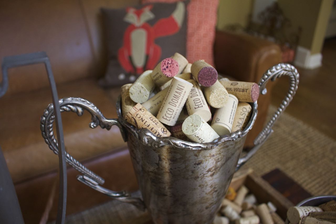 Fall Coffee Table decor. Vintage trohpies. Wine corks. feathers and natural elements on a wood tray