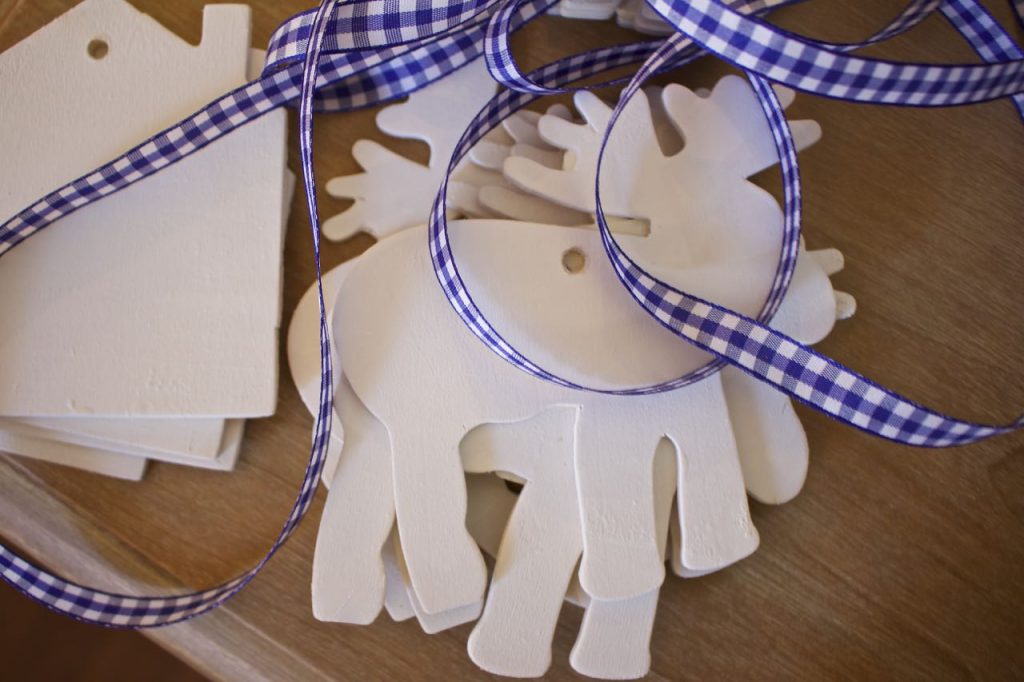 wooden-ornaments-are-all-painted-and-ready-to-be-hung