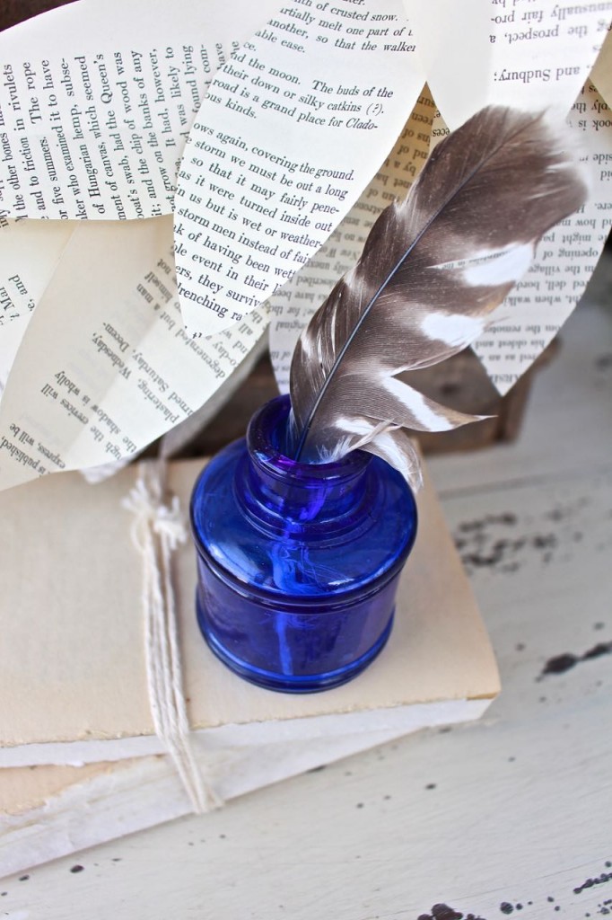 Book page magnolia wreath. Paited with vintage cobalt blue inkwell and feather.