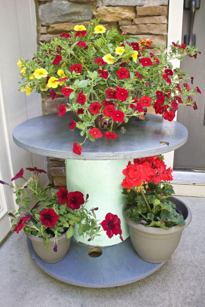 Wire Spool Table Plant Stand. Wire spool table DIY makeover. DIY wire spool plant stand.