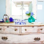 antique dresser is paired with a new mirror