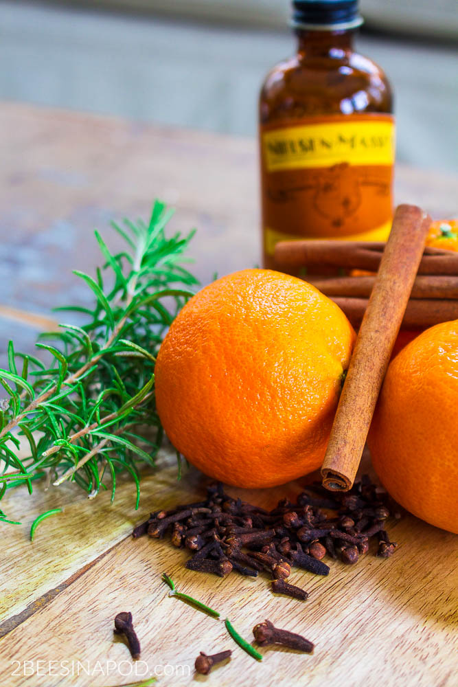 Rosemary and Citrus Orange Spice Simmer Pot - Banish Winter Funk. Fresh orange peels added to a pot of water with spices make a simmer pot.