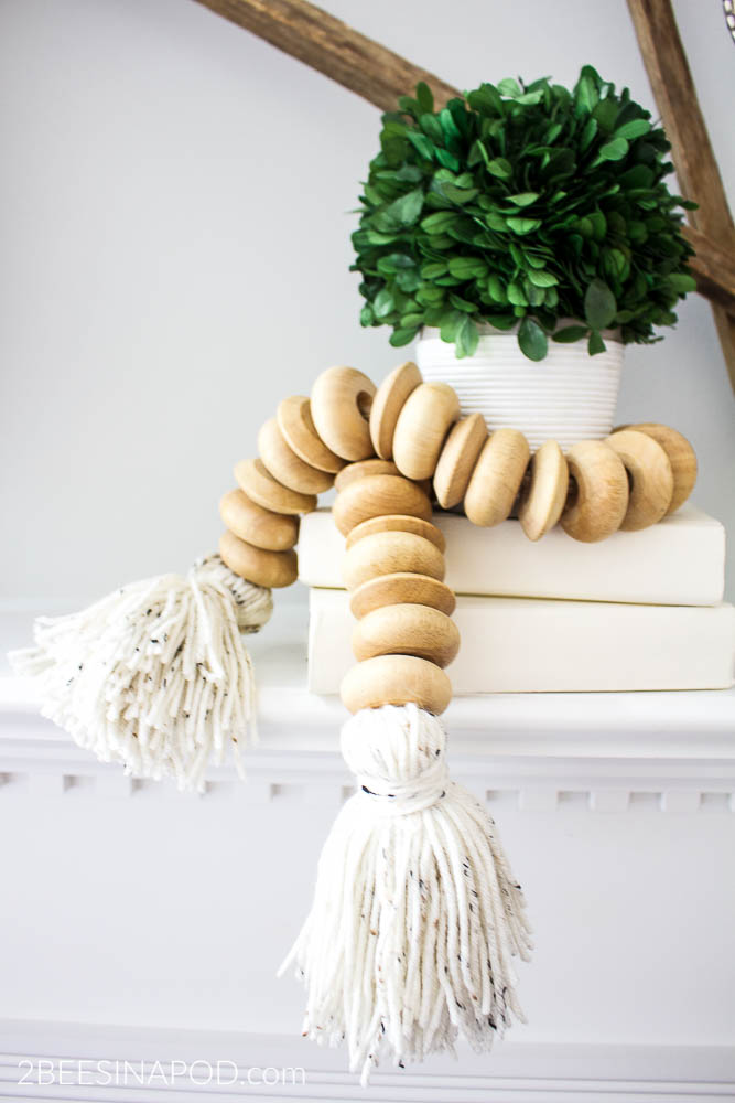 How to Make a Wood Bead Garland With Tassels. DIY wood bead garland with tassels.
