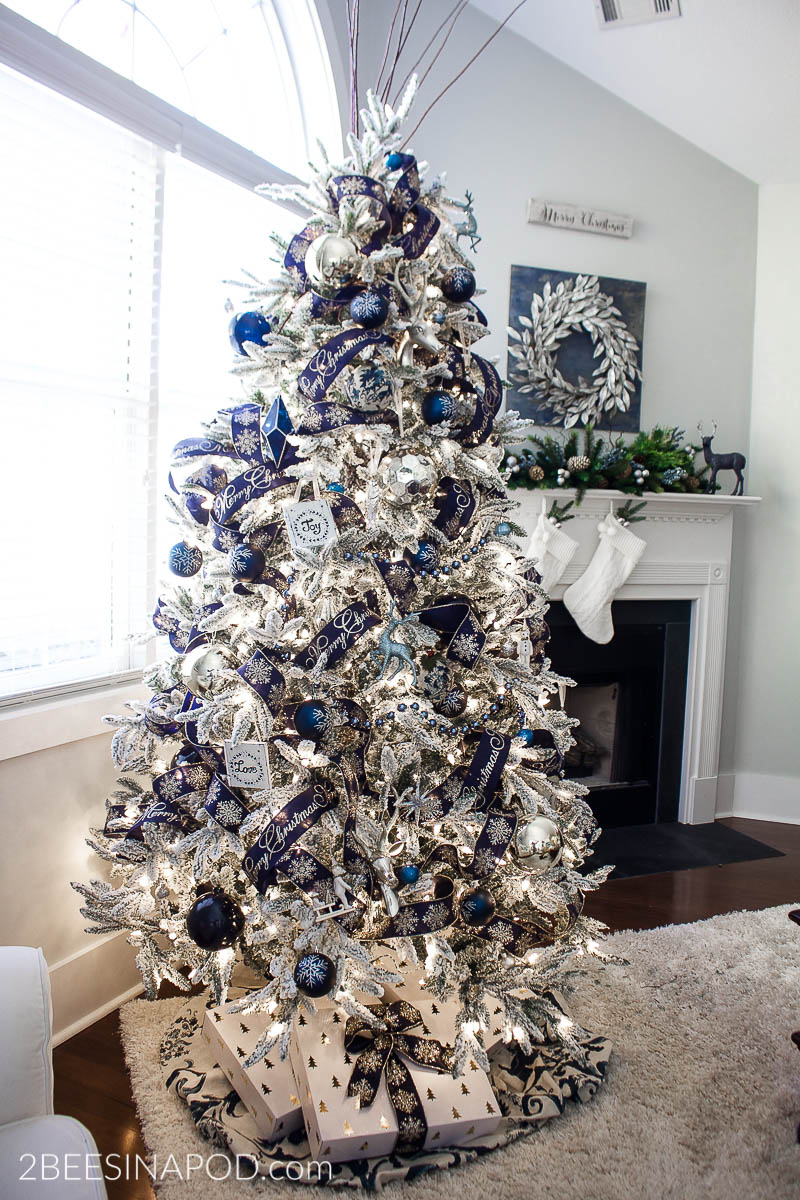 white christmas tree with blue and silver decorations