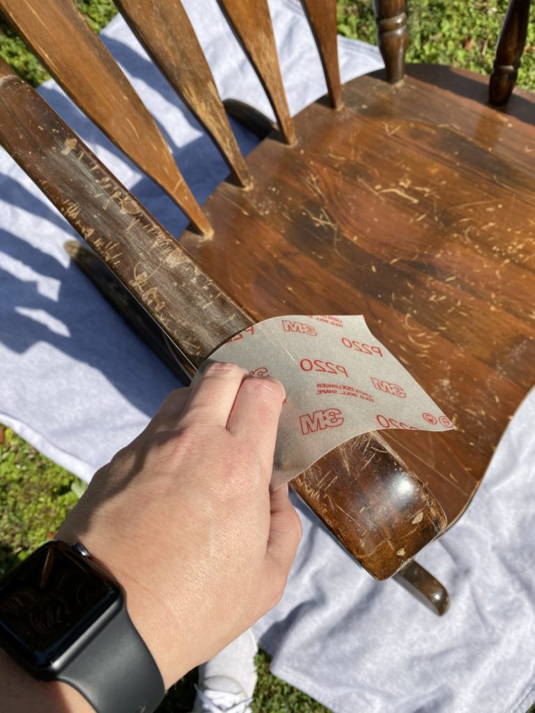 Sanding the chalk painted rocking chair